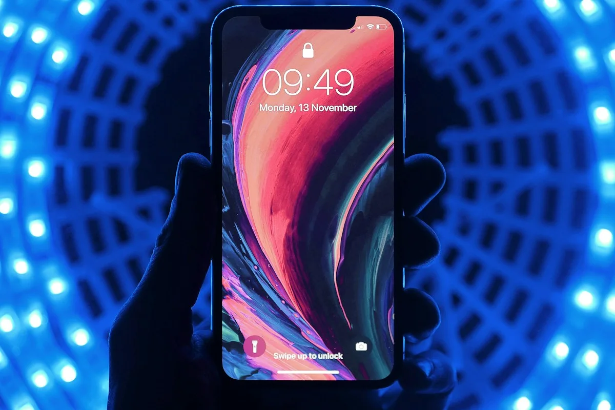 Phone held in front of blue lighting