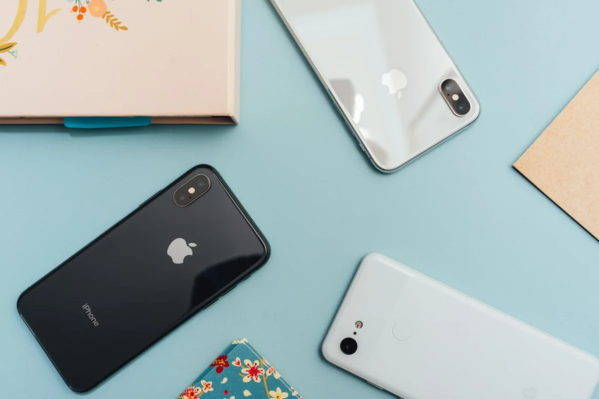 Smartphones arranged on a colorful surface