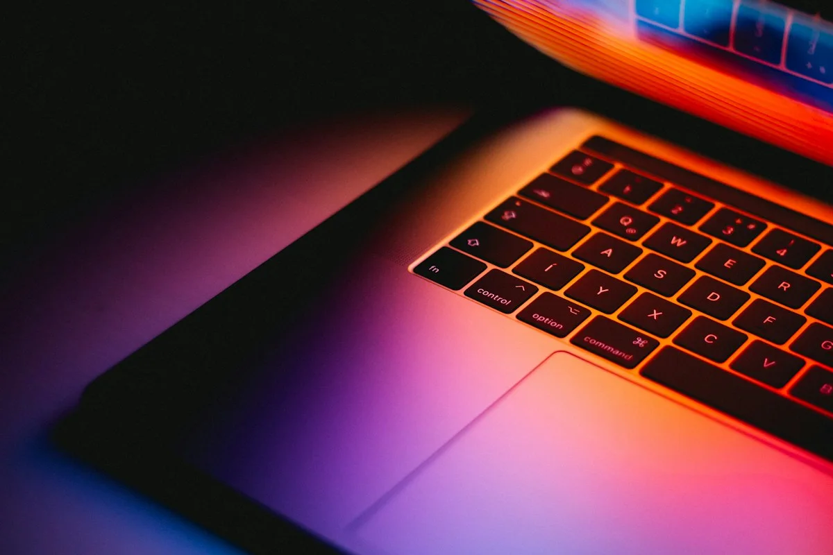 Laptop keyboard under warm lighting