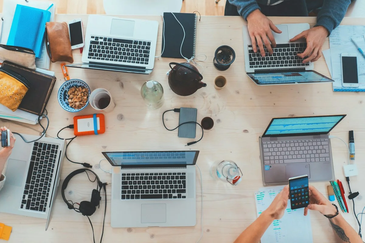 People working together with laptops