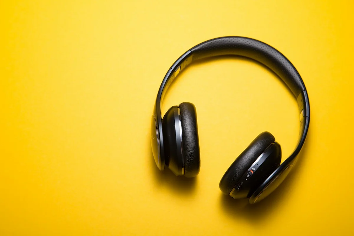 Headphones on a yellow surface